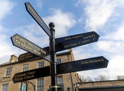 Fingerpost direct sign in historic town of Corsham, Wiltshire, England, UK