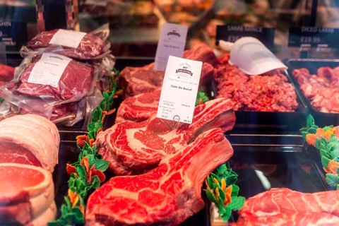Cote De Boeuf and other meat products in Toby Haynes Family Butcher shop window, Wiltshire,