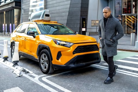 Well dressed man, embodying urban professionalism and sophisticated style, walking purposefully
