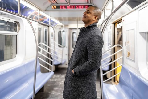 Young man riding new york city subway, traveling to work and navigating urban transport,