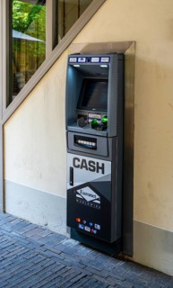 Euronet cash machine at the gateway to a backyard, Potsdam, Brandenburg, Germany