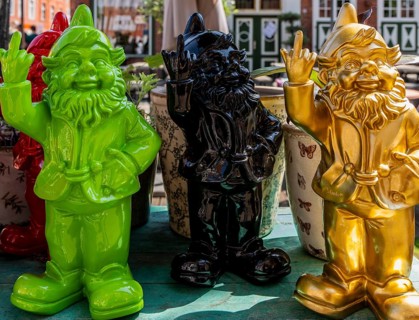 Colored garden gnomes, decoration in front of a shop in downtown Potsdam, Brandenburg, Germany