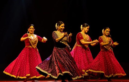 Artists perform a classical dance during a cultural evening program at Shilpgram Mohotsav 2026 in