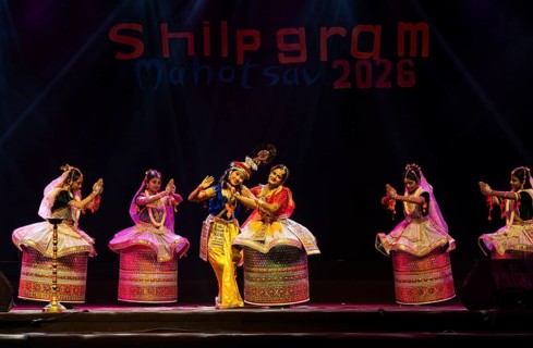 Artists perform classical Manipuri Ras Leela during a cultural evening program at Shilpgram
