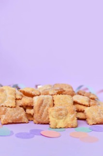 Rhenish pastries called 'Mutzen pastries or Muzenblätter' with powdered sugar on festive background