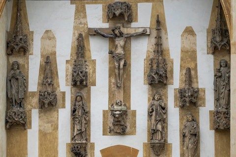 Christ sculpture and remains of the former monastery church of S. Johannes Baptistam above portal