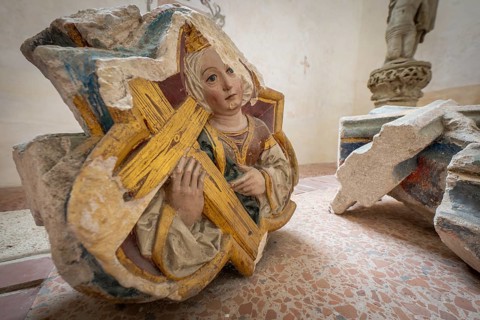 Medievally dressed woman with cross, remains of a wall relief, Blaubeuren Abbey, Swabian Jura,