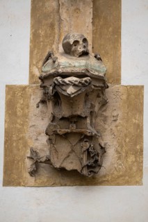 Weathered sculpture with skull, symbolizing transience in an ancient, Gothic style, Blaubeuren,