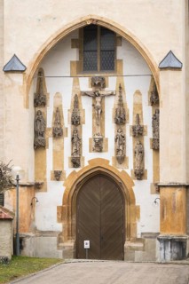 Christ sculpture and remains of the former monastery church of S. Johannes Baptistam above portal