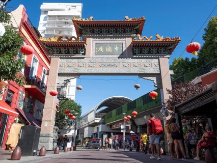 Tourists stroll in Chinatown with the Chinese archway, Buenos Aires, Argentina