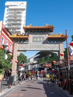Tourists stroll in Chinatown with the Chinese archway, Buenos Aires, Argentina
