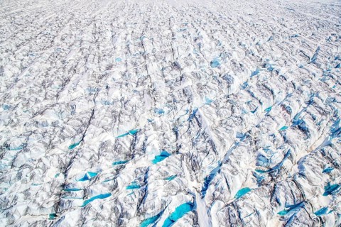 Aerial view of meltwater on the Greenland ice sheet, Arctic landscape, frozen wilderness, glaciers