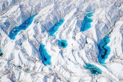 Aerial view of meltwater on the Greenland ice sheet, Arctic landscape, frozen wilderness, glaciers
