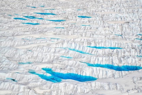 Aerial view of meltwater on the Greenland ice sheet, Arctic landscape, frozen wilderness, glaciers