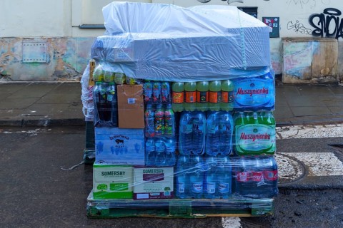 Pallet with drinks, covered in case of rain, Krakow, Poland