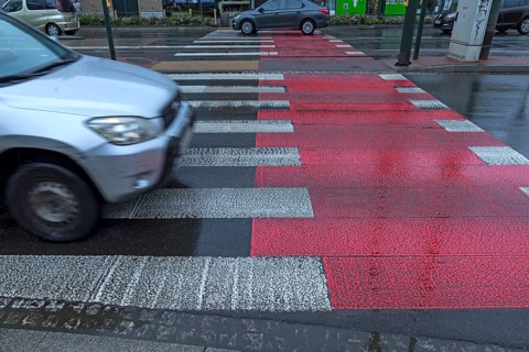 Zebra crossing marked in red and white, Krakow, Poland