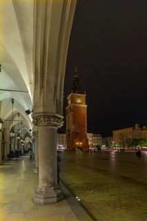 Bell tower and arcade of the Cloth Hall on the Market Square at night, Krakow, Poland