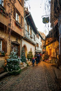 Christmassy decorated houses and alley with half-timbered houses, Christmas market, Eguisheim,
