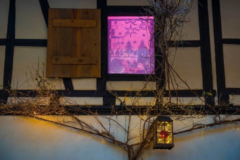 Christmassy decorated half-timbered house, Christmas market, Eguisheim, Haut-Rhin department, Grand