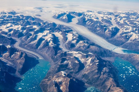 Aerial view of Greenland ice sheet, Arctic landscape, frozen wilderness, glaciers and snow-covered