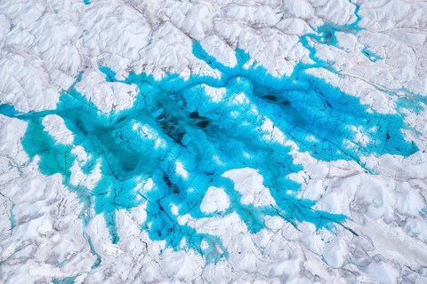 Aerial view of meltwater on the Greenland ice sheet, Arctic landscape, frozen wilderness, glaciers