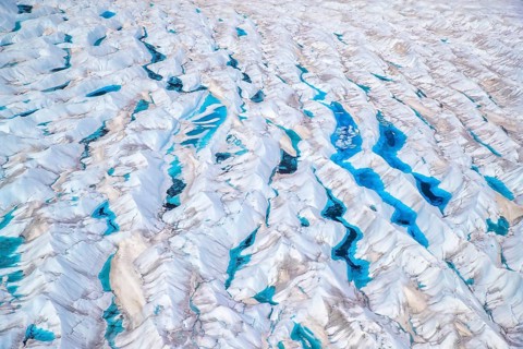 Aerial view of meltwater on the Greenland ice sheet, Arctic landscape, frozen wilderness, glaciers