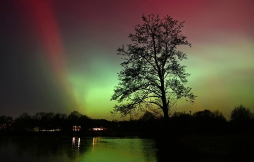 Northern lights, northern lights, on a lake in Schleswig-Holstein, Germany