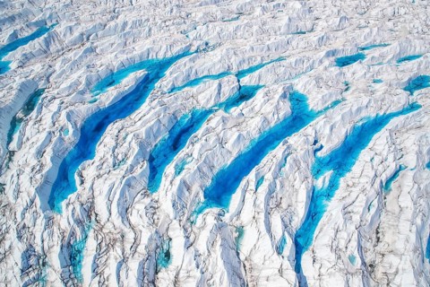 Aerial view of meltwater on the Greenland ice sheet, Arctic landscape, frozen wilderness, glaciers