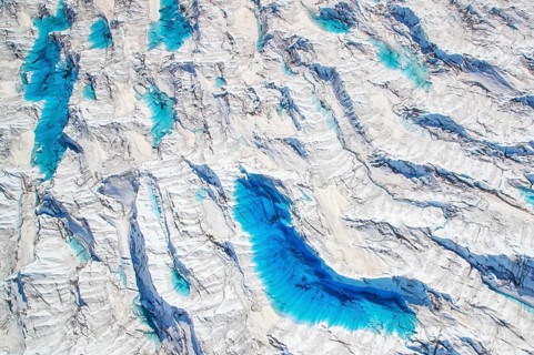Aerial view of meltwater on the Greenland ice sheet, Arctic landscape, frozen wilderness, glaciers