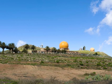 Radar domes on the Peñas del Chache against a blue sky, Caleta de Famara, Lanzarote, Canary