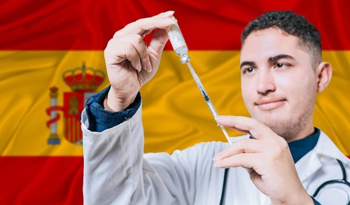 Doctor holding syringe on Spain flag background. Medical professional holding syringe with Spanish