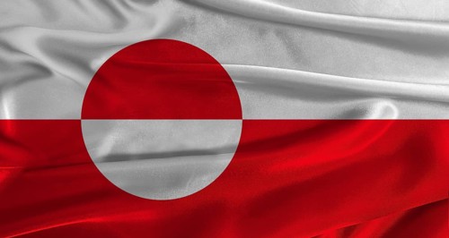 Flag of Greenland with fabric textured background. Close up of National flag of Greenland with