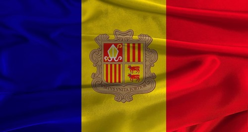 Flag of Andorra with fabric textured background. Close up of National flag of Andorra with