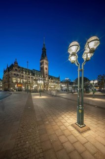 Hamburg City Hall with illuminated blue hour façade and street lamp in the foreground, Hamburg,