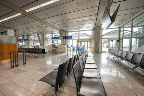 Modern, empty waiting area at the airport with elegant seats and large windows, Stuttgart Airport,