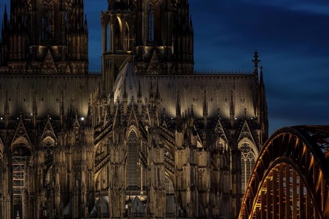 Evening atmosphere, Cologne Cathedral illuminated with LED lamps and the Hohenzollern Bridge,