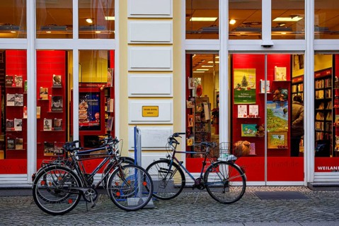 Bicycles parked in front of the Weiland bookstore at the fish market in the Hanseatic City of