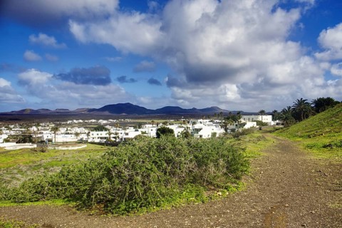Path to the municipality of Yaiza at the foot of green hills, Yaiza Lanzarote