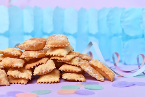 Rhenish pastries called 'Mutzen pastries or Muzenblätter' with powdered sugar on festive background