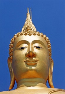 Portrait of the seated golden Buddha in Wat Phra Yai (Big Buddha Temple) at Hat Bangrak. The