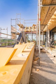 View of scaffolding with wooden panels under a clear sky, carpentry, new building, Stuttgart,