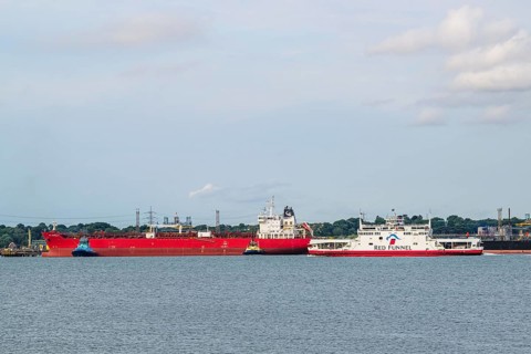 Red Funnel Ferry over refinery Esso Oil Terminal, Southampton, Hampshire, England, United Kingdom