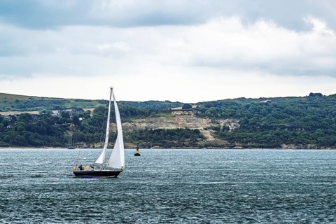 Boats over Hurst Point Lighthouse and Hurst Castle, Hurst Spit, Milford on Sea, Lymington,