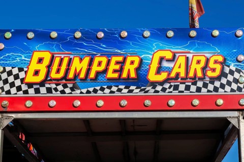 Close-up of Bumper Cars amusement ride banner at Fun Show traveling amusement ride park, Old Port