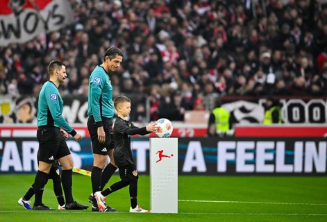 Start of a soccer Bundesliga game, shooting team led by referee Deniz Aytekin with ball child, ball