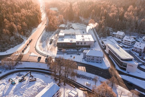 Snowy factories and roads near a forest area in winter time, Nagold, Calw district, Black Forest,
