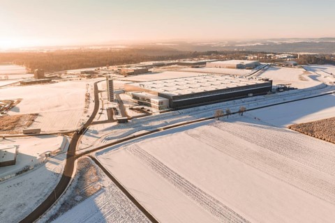 Large industrial site in snow-covered landscape under bright skies, Nagold, Calw district, Black