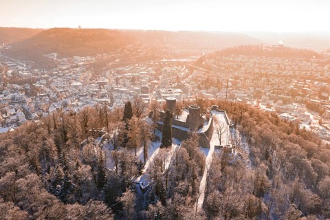 Panorama of a snowy town with a castle on a hill in the foreground, Nagold, Calw district, Black