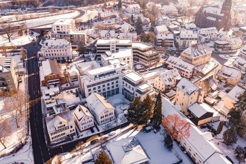 Snowy town with many houses and roads in the winter sun, Nagold, Calw district, Black Forest,