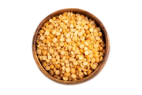 Split Pea raw in wooden bowl isolated on white background. Diet, healthy eating concept. top view,